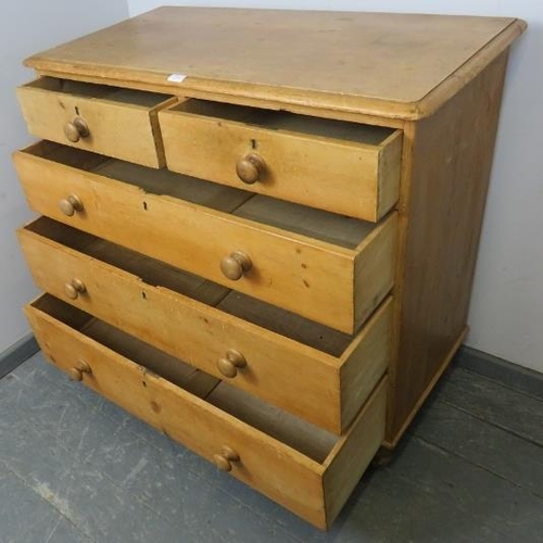 846 - A Victorian stripped pine chest of two short over three long graduated drawers with turned wooden kn... 