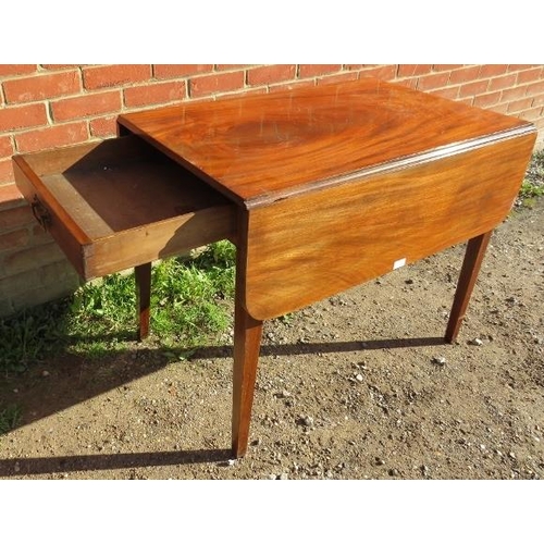 864 - A Georgian mahogany Pembroke table, with single drawer and dummy drawer, on tapering square supports... 