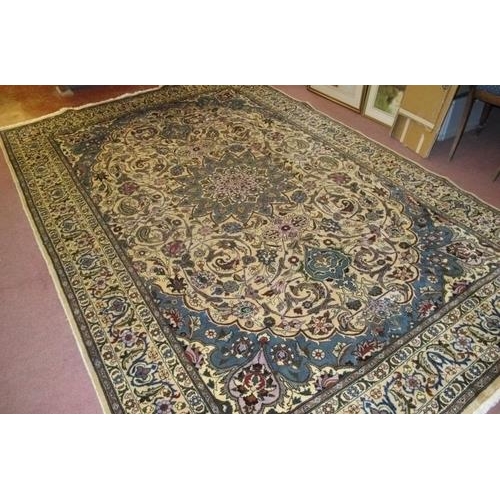 910 - A fine Persian Meshed carpet, central pattern motif, blue on cream heavy pattern and wide borders. 3... 