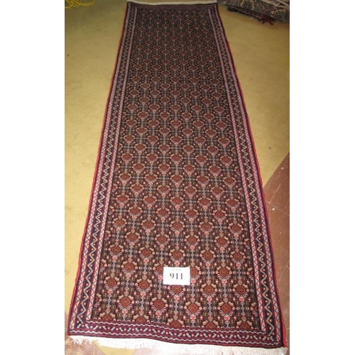 911 - North West Persian Senneh runner, repeat central pattern on blue field. 260cm x 80cm.