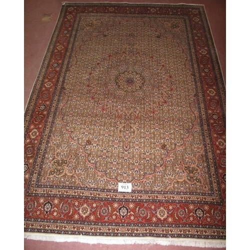 913 - A late 20th century Persian design wool carpet, pastel colours of cream-pink. In very good condition... 