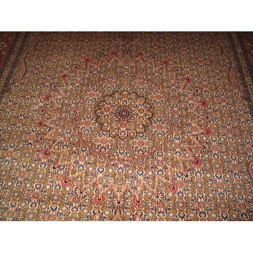 913 - A late 20th century Persian design wool carpet, pastel colours of cream-pink. In very good condition... 