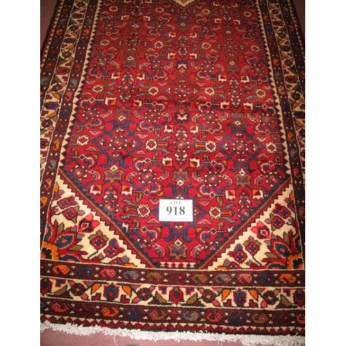 918 - A Persian Hamadan runner diamond motif to centre on claret ground. In very good condition. 322cm x 1... 