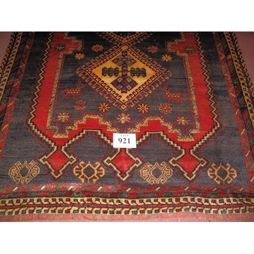 921 - A fine Persian Afshar rug with a tri central pattern on blue/red field. Good condition. 226cm x 142c... 