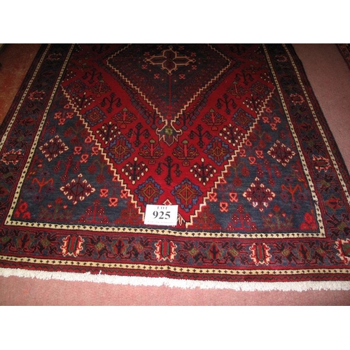 925 - A Persian Meimeh rug diamond motif on blue/red field in very clean condition. 200cm x 134cm.