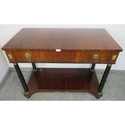 881 - A Regency Period mahogany and ebony console table, housing one long drawer with brass lion mask drop... 