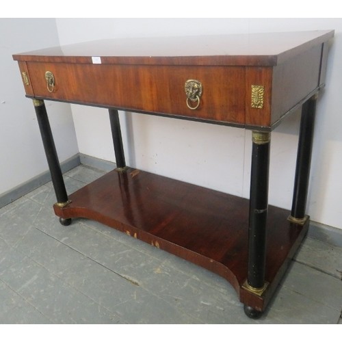 881 - A Regency Period mahogany and ebony console table, housing one long drawer with brass lion mask drop... 