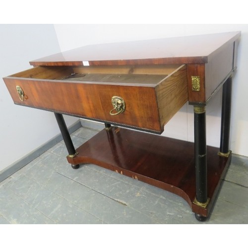 881 - A Regency Period mahogany and ebony console table, housing one long drawer with brass lion mask drop... 