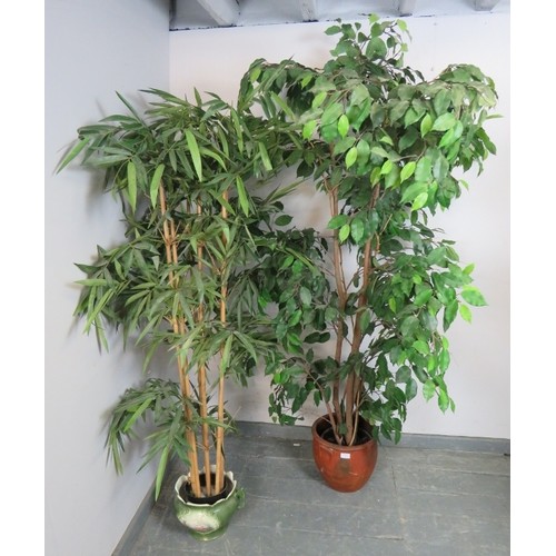 892 - Two large artificial plants, comprising a bamboo and a bay leaf.
Condition report: Some losses. One ... 