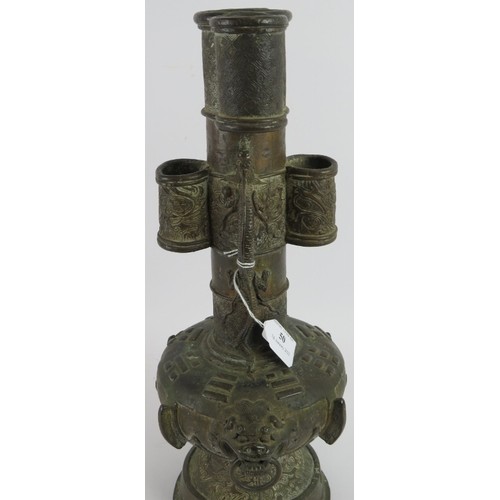 50 - An antique Chinese bronze vase in the Archaic style decorated with dragons and with lion mask handle... 