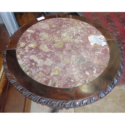 707 - A 19th century Chinese rosewood circular occasional table, with inset red marble top above a foliate... 