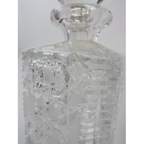 102 - A pair of heavy quality cut crystal square spirit decanters, height 24cm.
Condition report: Stopper ... 