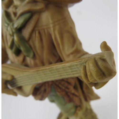 103 - A pair of Bohemia Royal Dux figures depiction a lute player and tambourine player. Height is 33.5cm.... 