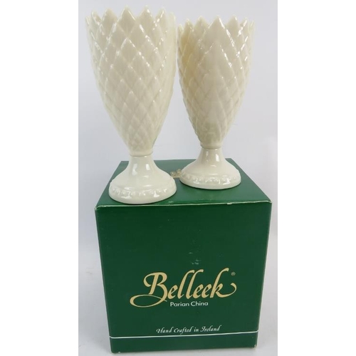 114 - A pair of Irish Belleek porcelain goblets/vases, relief moulded to simulate fir cones, 15cm high, wi... 