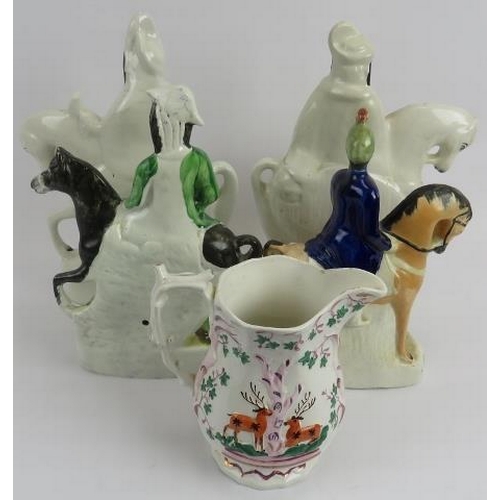 13 - Pair of Staffordshire figures on horseback, Dick Turpin and Sutton, and hunting jug. The pair 33cm h... 