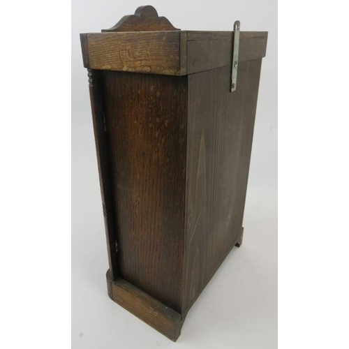 131 - An early 20th century oak cased striking mantel clock with pendulum and key. Height 38cm. 
Condition... 