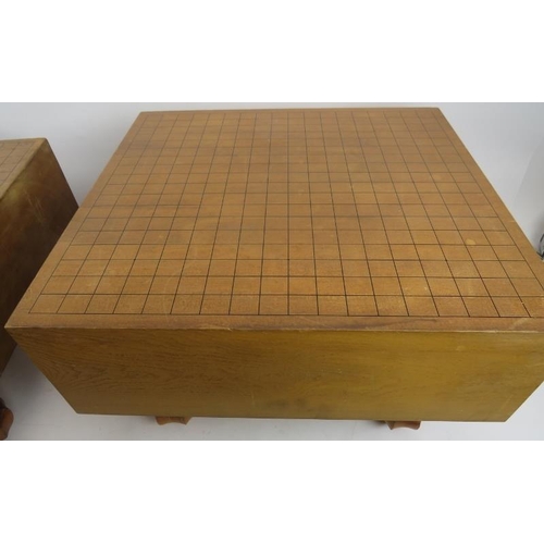 135 - Two vintage Japanese 'Go' gaming board tables, each raised on four fluted legs. Largest 45cm x 42cm ... 