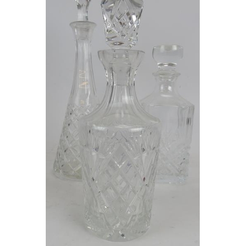 143 - Three cut glass decanters with stoppers. Tallest 50cm high.
Condition report: Chips to stopper of bo... 