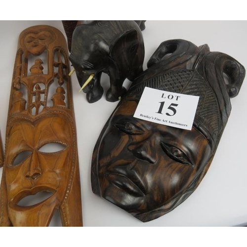 15 - African hardwood carvings, 2 pairs of elephants, and 4 face masks. Elephants 18cm height approximate... 