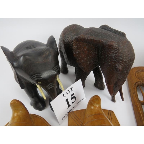 15 - African hardwood carvings, 2 pairs of elephants, and 4 face masks. Elephants 18cm height approximate... 