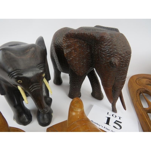 15 - African hardwood carvings, 2 pairs of elephants, and 4 face masks. Elephants 18cm height approximate... 