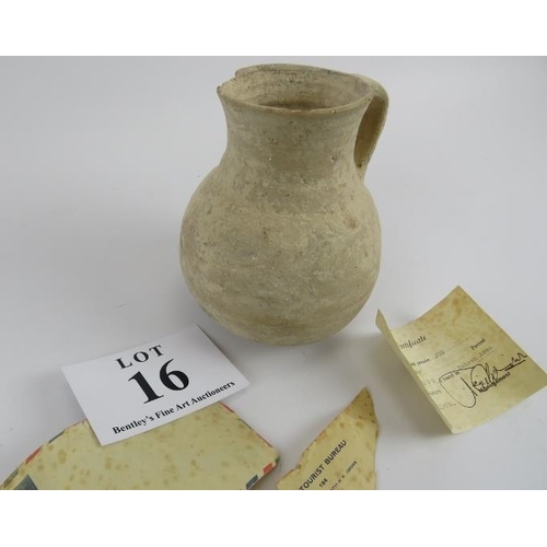 16 - Iron age jug circa 1200-930 BC, found in the Hebron area, with certificate, 17cm height. 
Condition ... 