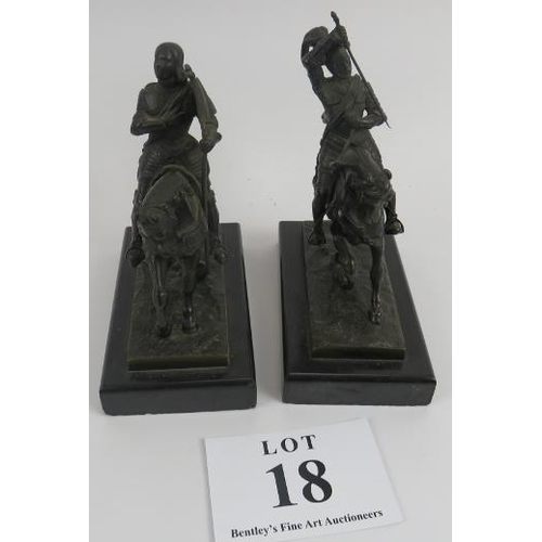 18 - Pair of 19th century bronze figures of knights on horseback upon slate bases, 22cm height. 
Conditio... 