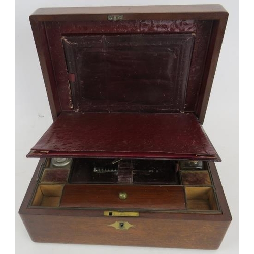 202 - A Victorian mahogany travelling vanity box, the brass inlaid hinged lid enclosing a fitted interior,... 