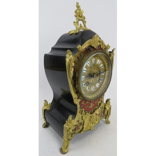 203 - A French ormolu mounted boulle inlaid and ebonised mantel clock in the Louis XVI style, early 20th c... 