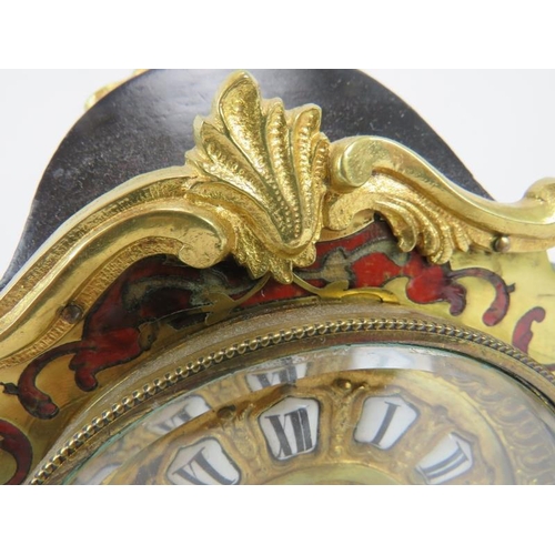 203 - A French ormolu mounted boulle inlaid and ebonised mantel clock in the Louis XVI style, early 20th c... 