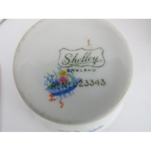 215 - A Shelley 36 piece tea service, decorated with bright floral sprays, comprising 12 cups, 12 saucers,... 