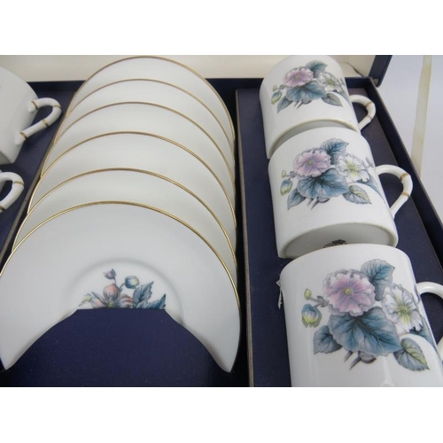 216 - A boxed set of 6 Royal Worcester coffee cans and saucers, 8 matching loose cans and 5 saucers, and a... 