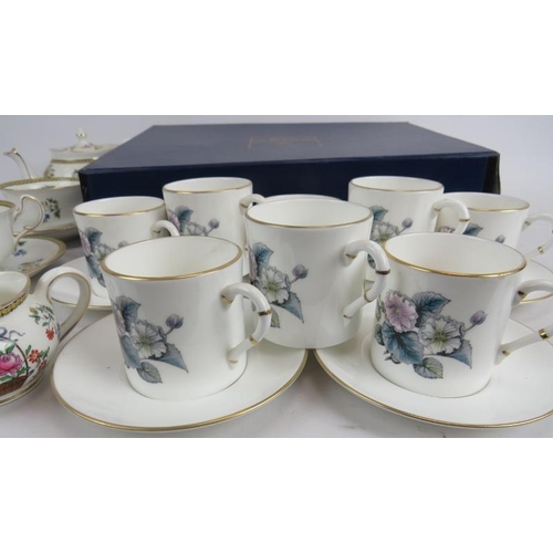 216 - A boxed set of 6 Royal Worcester coffee cans and saucers, 8 matching loose cans and 5 saucers, and a... 