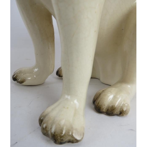 239 - A pair of antique Staffordshire pottery models of seated pug dogs, 28cm high.
Condition report: Some... 