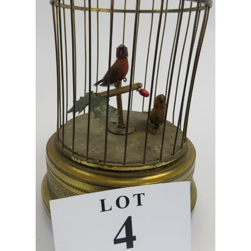 4 - 20th century pressed and gilded metal clockwork birds in cage, working order, 30cm height x 16cm wid... 