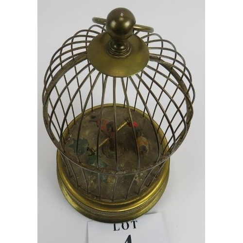 4 - 20th century pressed and gilded metal clockwork birds in cage, working order, 30cm height x 16cm wid... 