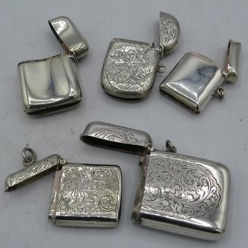 405 - A collection of five silver vesta cases. Three with foliate engraved design, one with monogram and o... 