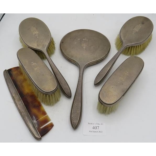 407 - A six piece Art Deco silver dressing table set comprising of mirror, two hair brushes comb and two c... 