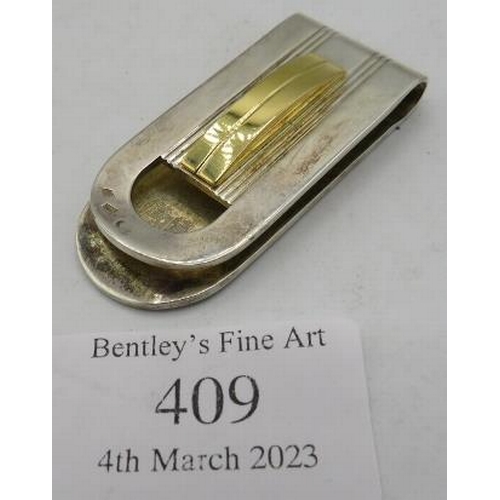 409 - A 925 stamped Dupont money clip, boxed. Approx weight 32 grams.
Condition report: Surface scratching... 