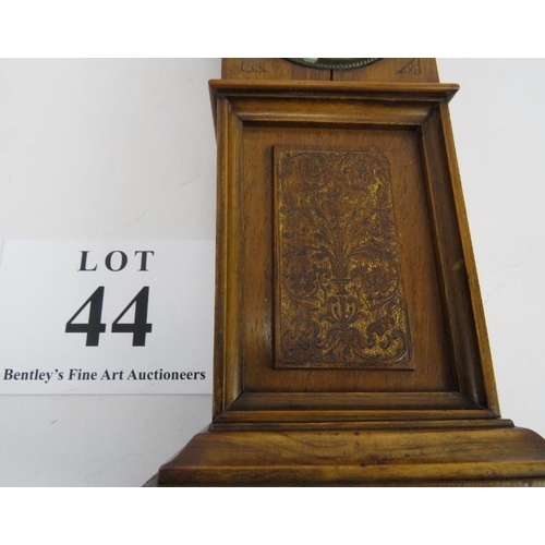 44 - Miniature long case clock, walnut, traces of gilding to etched panel, not tested, 18cm height. 
Cond... 