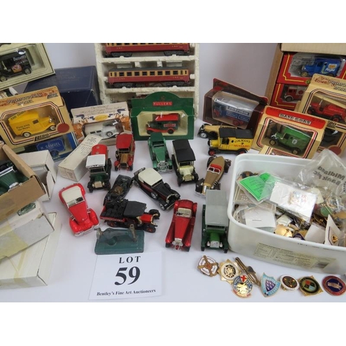 59 - Large collection of diecast and model vehicles, many in original packaging, 00 gauge train and track... 