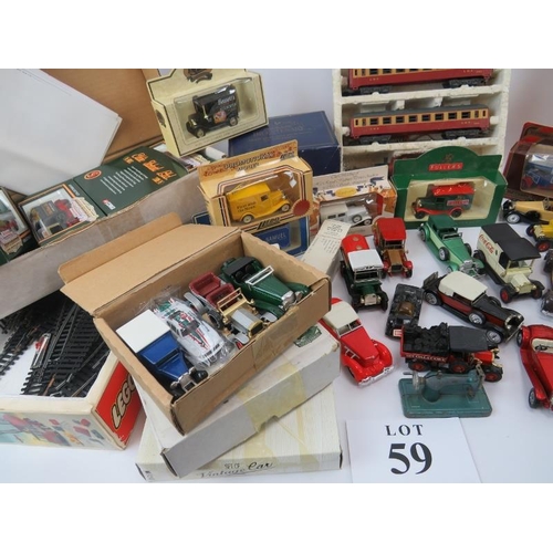 59 - Large collection of diecast and model vehicles, many in original packaging, 00 gauge train and track... 