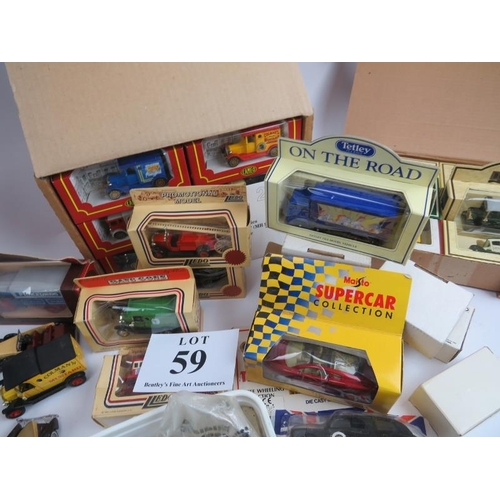 59 - Large collection of diecast and model vehicles, many in original packaging, 00 gauge train and track... 