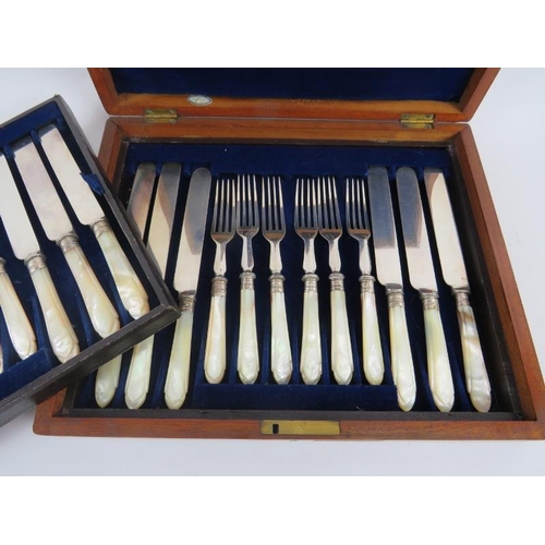 73 - A set of 12 nice quality 19th century knives and forks with mother of pearl handles, contained withi... 