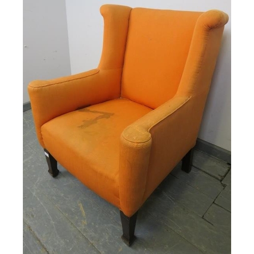 877 - A Georgian wingback armchair of small proportions, reupholstered in orange material with a grey loos... 