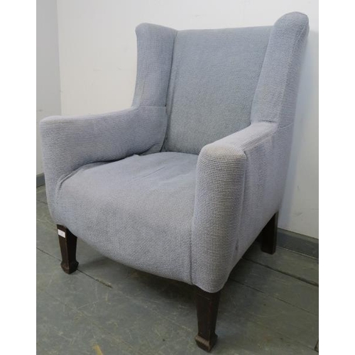 877 - A Georgian wingback armchair of small proportions, reupholstered in orange material with a grey loos... 