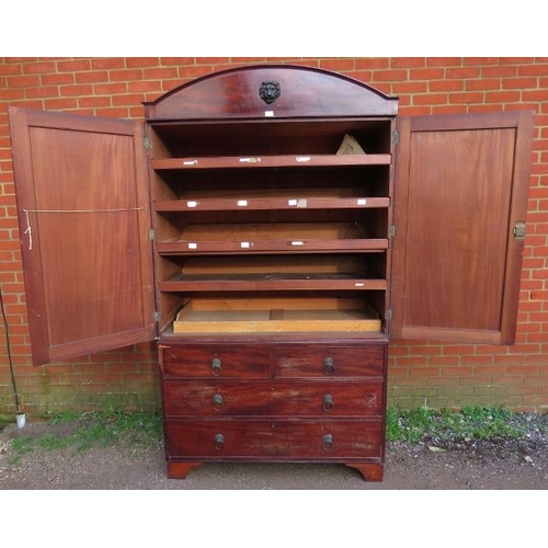 882 - A Regency Period mahogany linen press, the cornice with ebony inlay and central lion mask, above a c... 