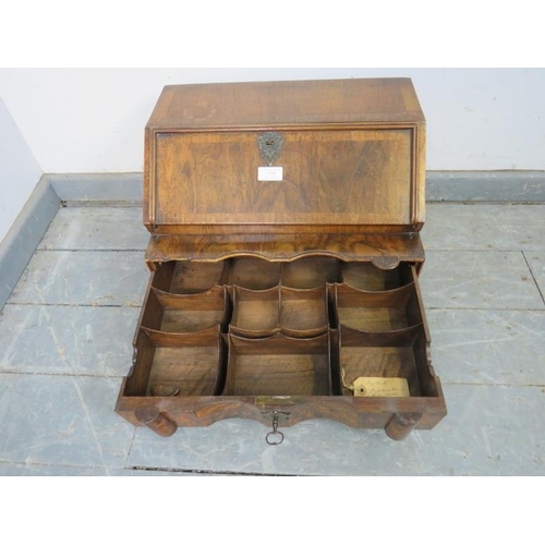 705 - A fine 19th century figured walnut table-top writing desk in the Queen Anne taste, the fall front op... 