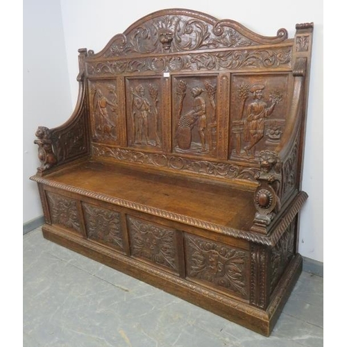 708 - A 19th century high-back oak box settle, the very ornate relief carving depicting a central lion mas... 