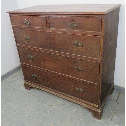 711 - An 18th century oak chest of two short over three long graduated cock-beaded drawers, on bracket fee... 